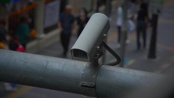 Urban surveillance cameras monitor the bustling life of streets in a busy city environment video