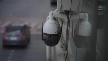 Surveillance cameras on city streets monitor traffic conditions at different times of day video