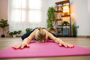 Engaging in relaxed yoga practice during a calming indoor session photo