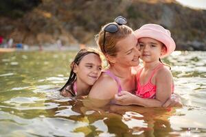 Joyful family moments at the beach on a sunny summer day photo