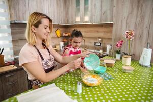 Enjoying a creative baking session in a cozy kitchen with family photo