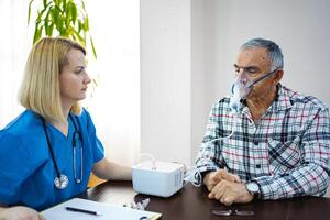 Elderly man receives respiratory treatment with care photo