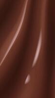 Waves of bitter or milk chocolate moving. Abstract brown food portrait background, close up of cocoa, chocolate dessert creamy milk chocolate texture surface, Liquid hot chocolate texture video