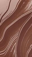 Waves of bitter or milk chocolate moving. Abstract brown food portrait background, close up of cocoa, chocolate dessert creamy milk chocolate texture surface, Liquid hot chocolate texture. video