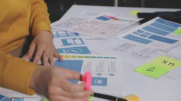 A person is working on a project with a lot of papers video