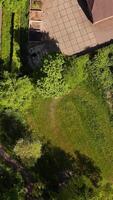 Aerial view of a house with a garden and a driveway video