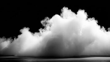 A thick cloud of white smoke sits on a dark stage, perfect for atmospheric backgrounds photo