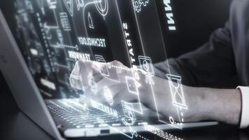 Businessman working on laptop with glowing futuristic interface showing teamwork video