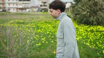 Man Walking In The Nature During Autumn And Looking At Some Bare Tree Branches video