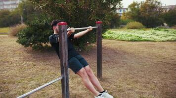 Effort Of An Athlete Training His Arms Outdoors At The Park video