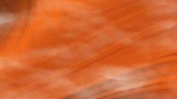 halloween dynamisk orange vågor en vibrerande visa av orange nyanser skapar en fängslande, abstrakt sammansättning, frammanande en känsla av rörelse och energi i en vätska konstnärlig tolkning. video