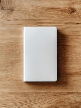 Blank white notebook on wooden surface perfect for journaling and sketching photo