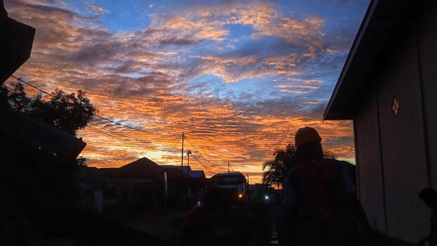 A man is standing on the street with a camera photo