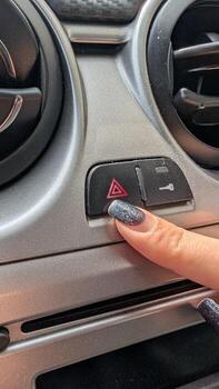 A CloseUp View of the Hazard Warning Button on a Car Dashboard, Highlighting Its Importance photo