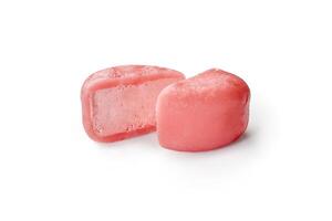 Pink mochi ice cream being cut in half on white background photo