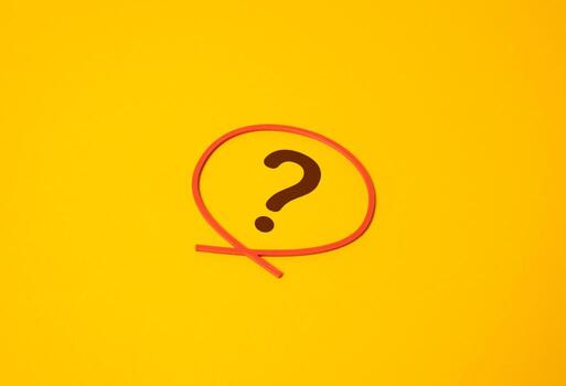 The question mark is outlined in a red circle. Focus on a question or uncertainty. Pending issues in business, politics, or personal finance. Unresolved problems, doubt. photo