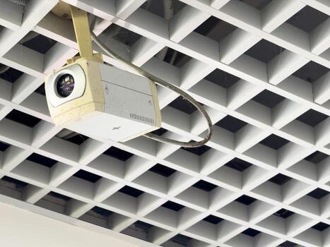 A security camera on the ceiling follows every step photo