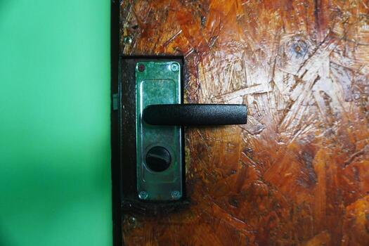 old lock. Flimsy at first glance, but a proven item for many years that allows you to protect yourself from unauthorized entry. photo