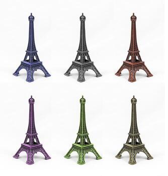 Six multicolored Eiffel Tower models, isolated on white background photo