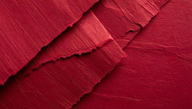 Close-up of deep crimson paper texture, ideal for presentation backgrounds with a red pattern. photo