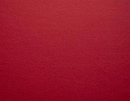 Close-up of deep crimson paper surface, ideal for presentation backgrounds with a textured pattern photo