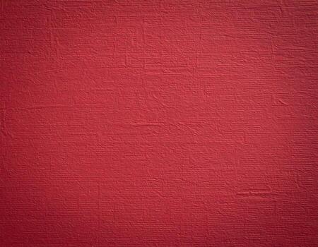 Close-up of deep crimson paper with a textured background, ideal for presentation slides photo