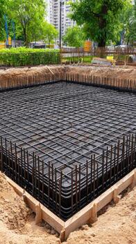 A concrete slab is being poured in a construction site photo