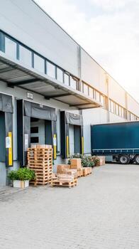 A large warehouse with pallets and trucks photo