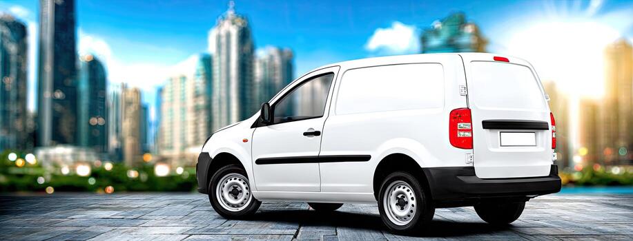 A white van is parked in front of a city photo