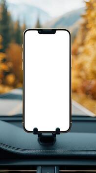 Mockup of smartphone on dashboard of car with autumn trees background photo