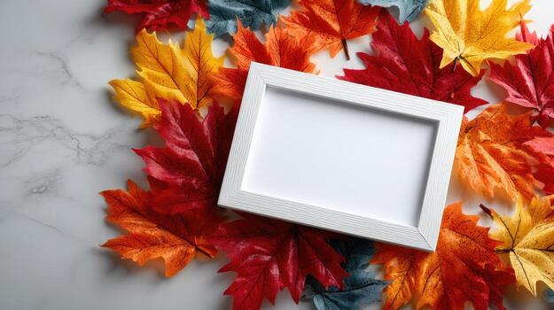 Autumn leaves and white frame on marble background photo
