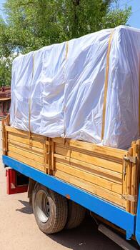 A truck with a tarp on the back photo