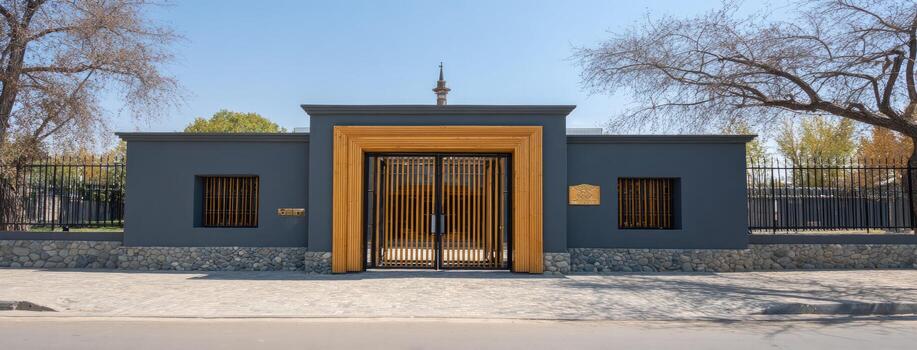 The entrance to a building with a black door and a fence photo