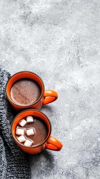 Hot chocolate with marshmallows on gray background photo