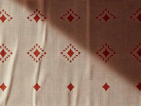 Rustic Beige Fabric Texture with Red Diamond Pattern Elegant Background for Design Projects photo