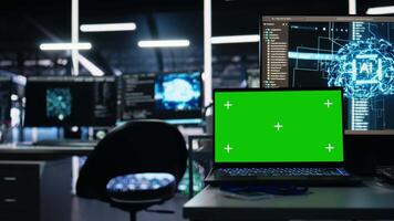 Close up of isolated screen laptop in data center used for AI development and machine learning coding. Server room chroma key notebook used for tracking neural network structures algorithm performance video
