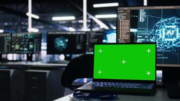 Close up of mockup laptop in data center doing neural network visualization using code debugging tech. Isolated screen notebook in server room powering deep learning and automated research tasks video