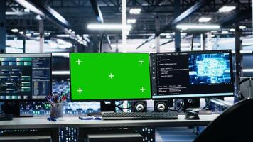 Server room chroma key PCs tracking rigs processing machine learning datasets for artificial intelligence operations. Green screen computers monitoring gear used in AI large language model development video