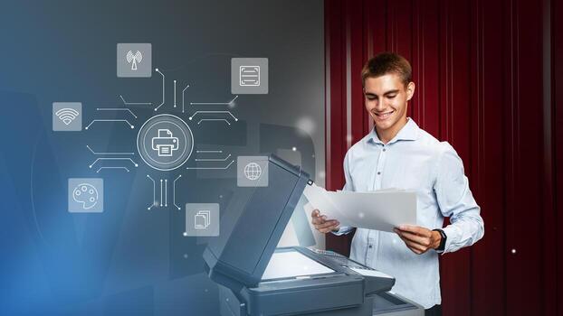 Young man using a multifunction printer in an office setting while reviewing printed documents and accessing digital features photo