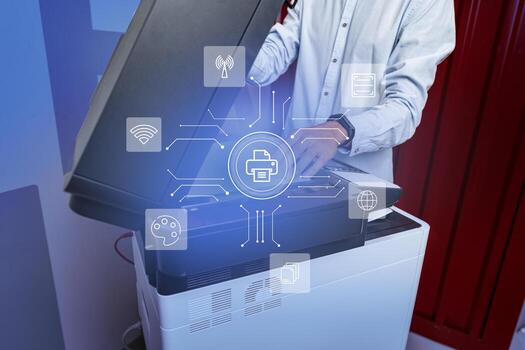 Technician working at a modern multifunction printer in an office environment during daytime, utilizing various digital features photo