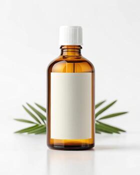A bottle of essential oil with a leaf on a white background photo