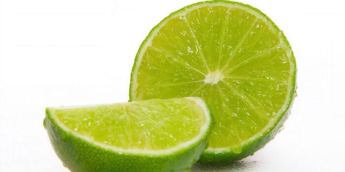 Freshly sliced lime, showcasing its vibrant green color and juicy texture, ready to be enjoyed. photo