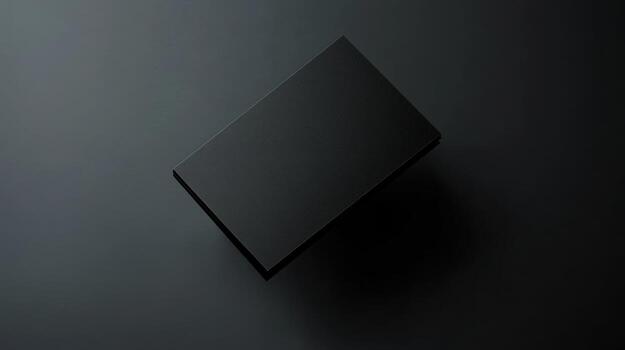 A black rectangular box on a dark gray surface photo
