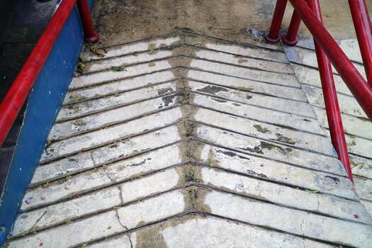 Concrete Ramp with Red Railings for Accessibility photo