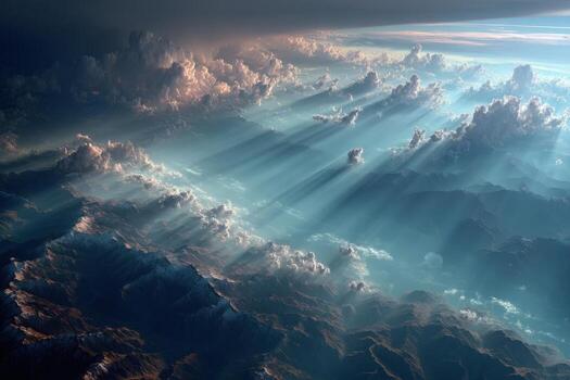 The sun shines through clouds over a mountain range photo