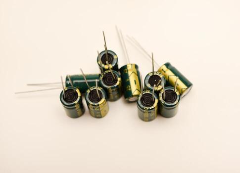 Multiple electrolytic capacitors with different values. Common components in amplifiers, power supplies, and PCBs. photo