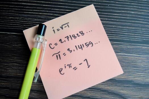Concept of important euler equation write on sticky notes isolated on Wooden Table. photo