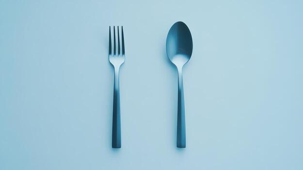 A studio shot of a fork and spoon photo
