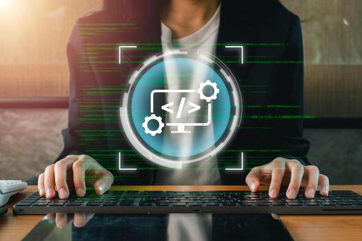 A web developer typing on a keyboard with digital code and interface elements overlay, symbolizing modern web development. photo