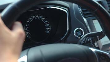 Hand pressing start button to turn on car engine video